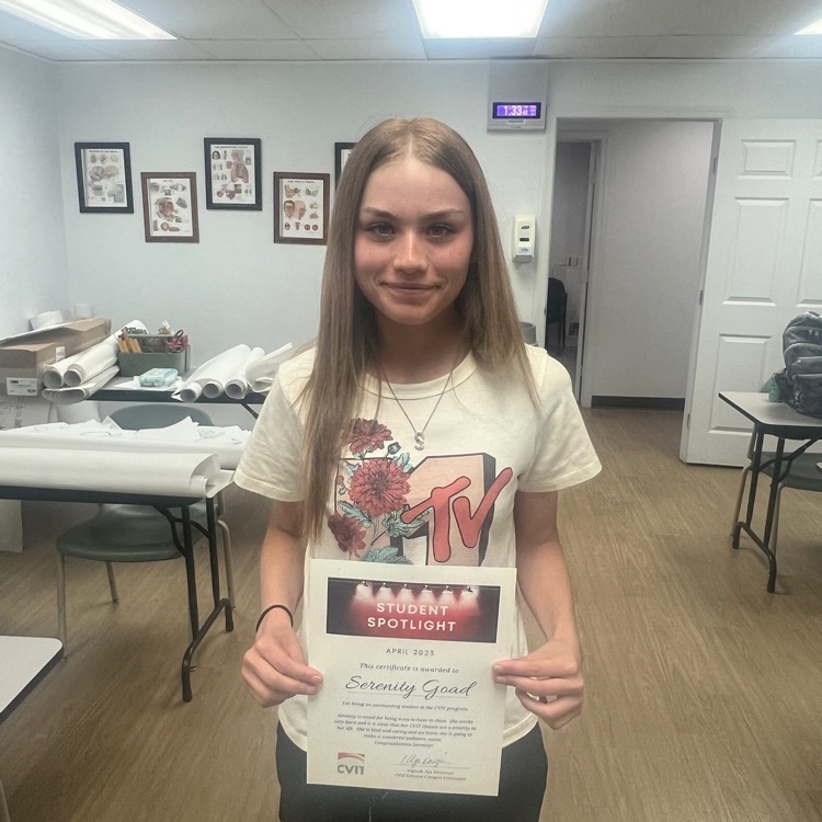 female student holding certificate
